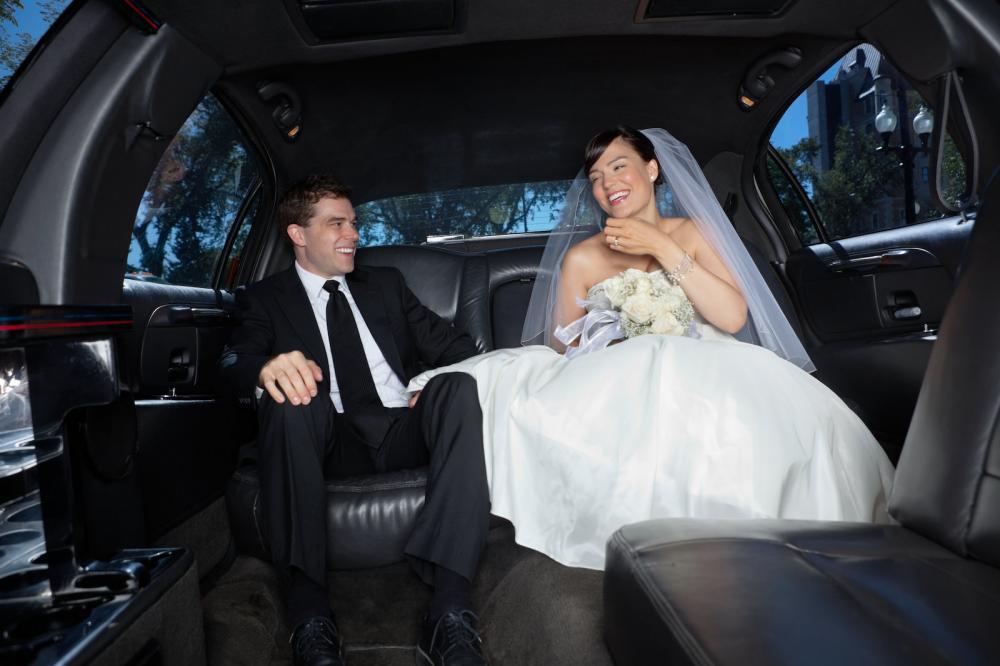 newly wed couple in limousine